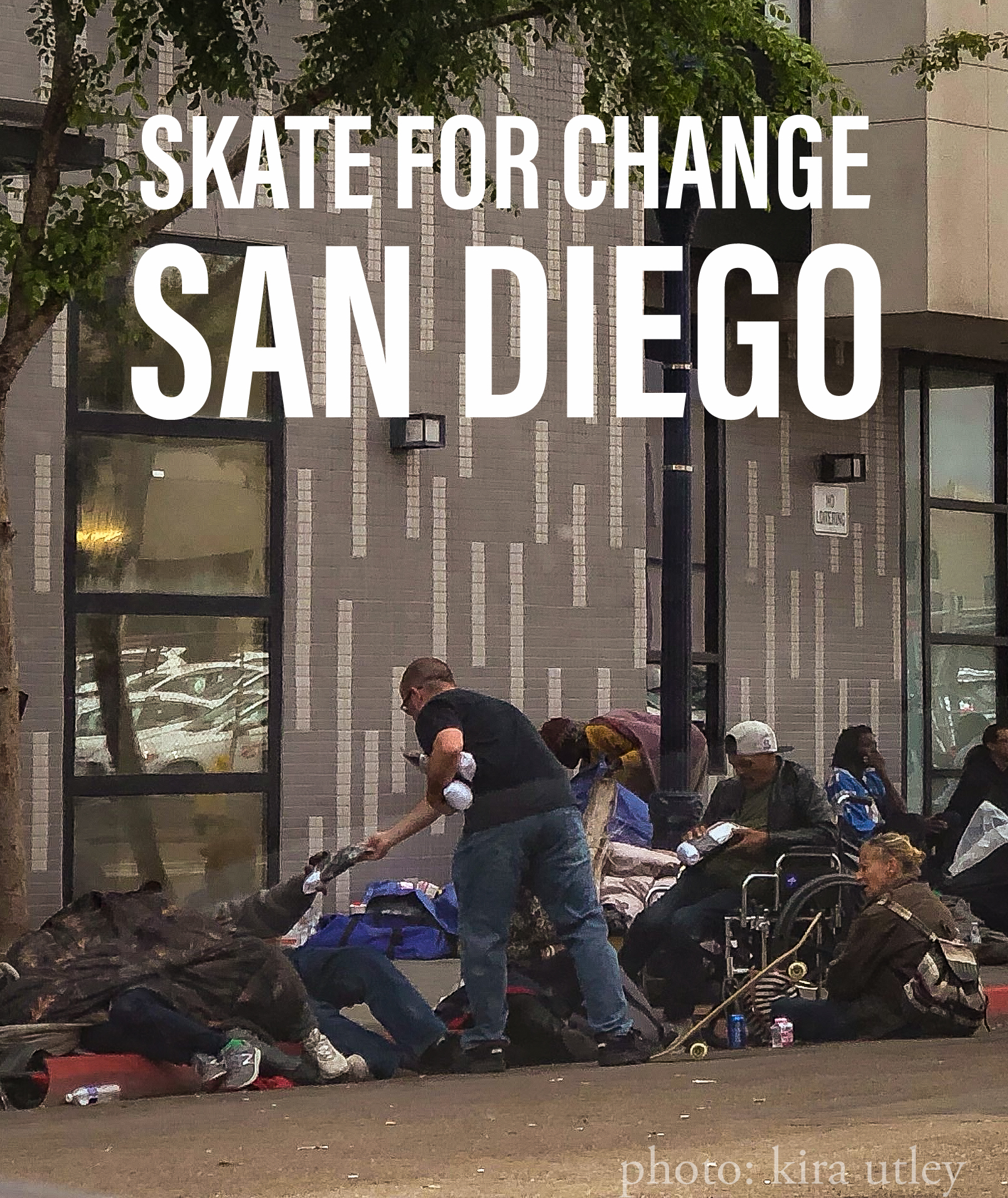 Josh Utley handing out socks in downtown San Diego